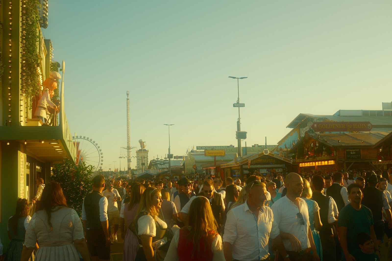 Visitors gathering at a sunny outdoor festival